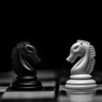 white ceramic figurine on black table
